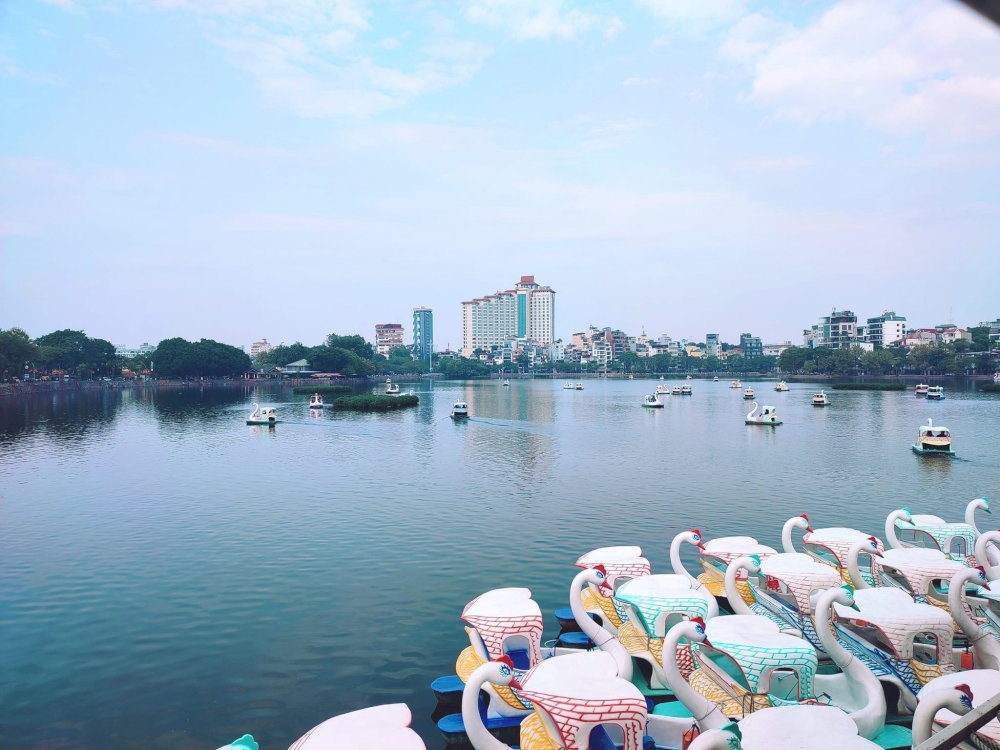 Glide across Truc Bach Lake in a swan pedalo